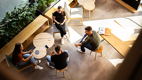 Visitors sit and chat in the STIHL brand world café.